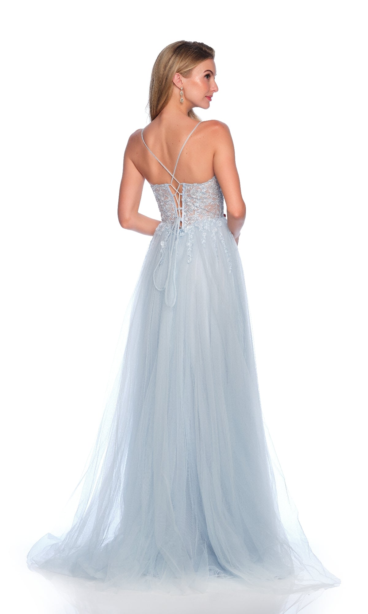 Woman wearing the Dave and Johnny 12090 long prom dress, a light blue gown with a lace-up corset bodice and flowing A-line tulle skirt, shown from the back against a white background.